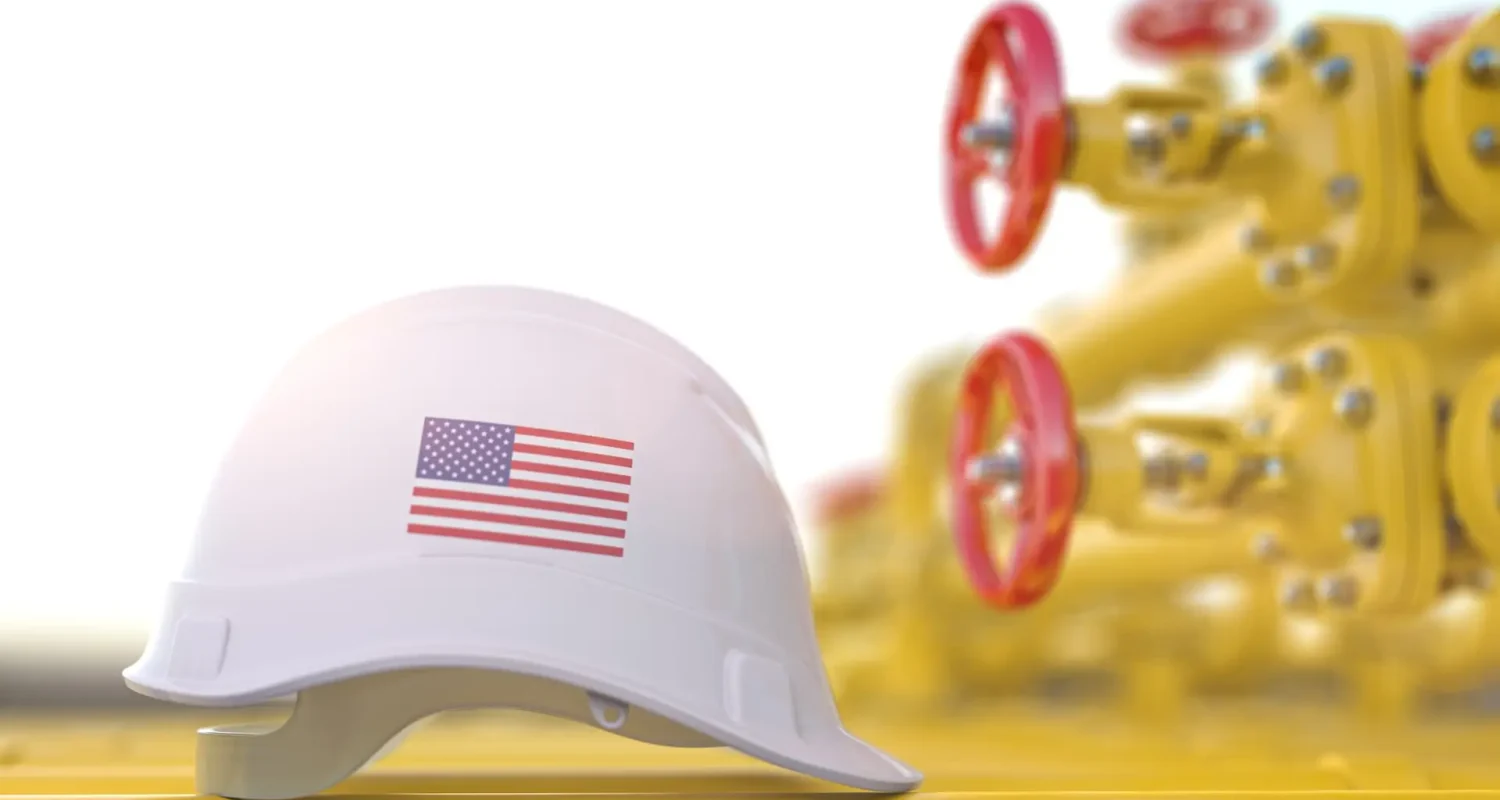 Oil and gas industrial of USA. United States flag on a hard hat with gas valve tubes.